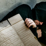 sleeping under cardboard on the streets of america